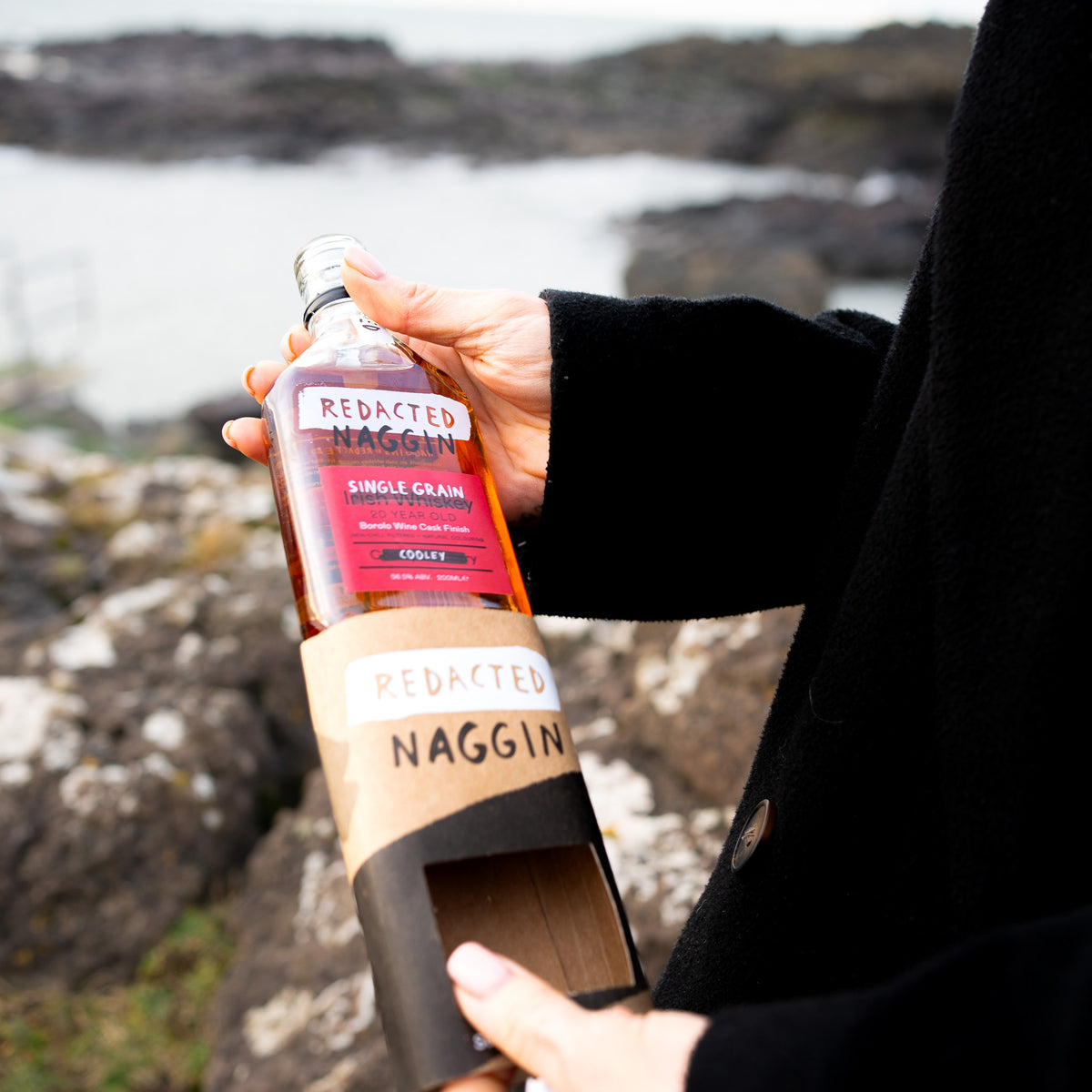 Single grain label on Redacted's whiskey naggin